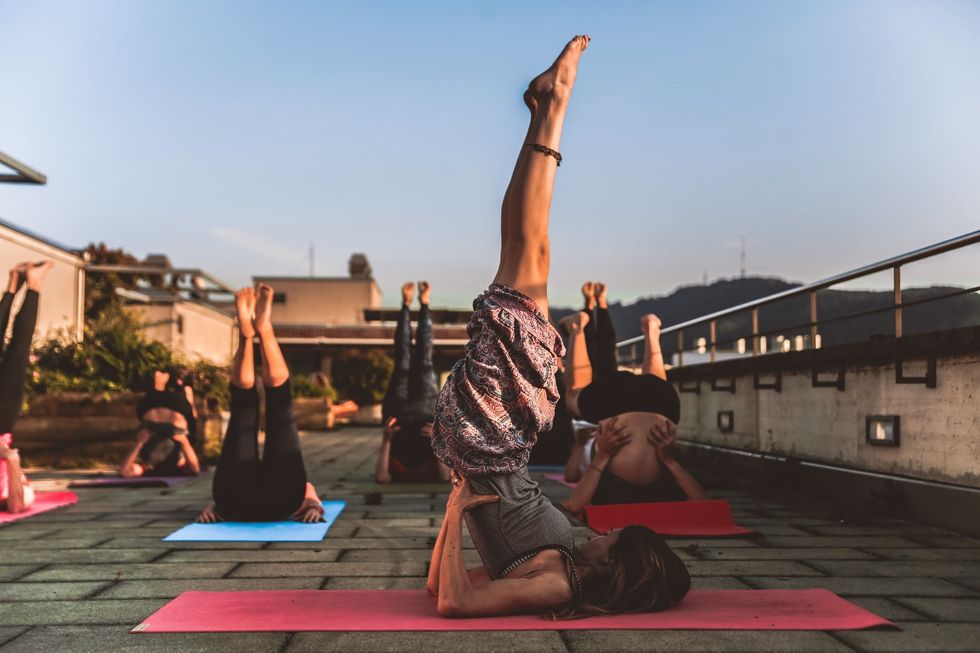 https://www.pexels.com/photo/group-of-women-lying-on-yoga-mat-under-blue-sky-1375883/
