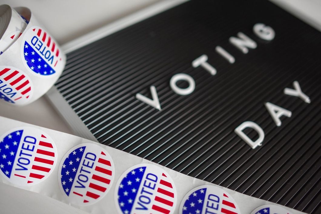 https://www.pexels.com/photo/i-voted-sticker-lot-1550340/