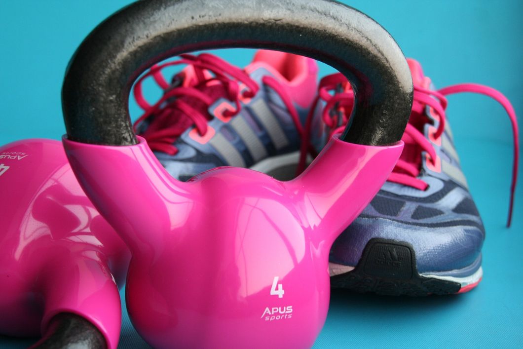 https://www.pexels.com/photo/kettle-bell-beside-adidas-pair-of-shoes-209968/