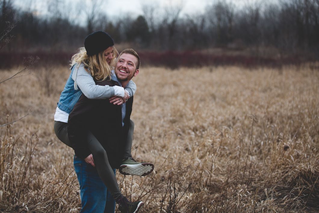 https://www.pexels.com/photo/man-carrying-woman-standing-on-the-ground-and-surrounded-by-grass-853406/