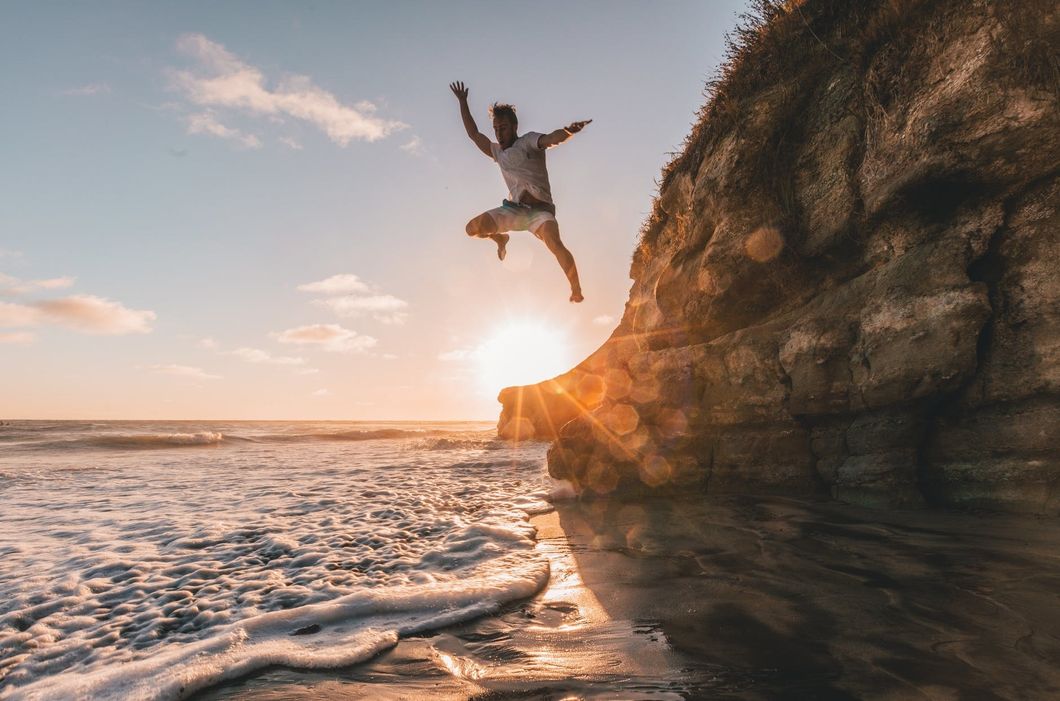 https://www.pexels.com/photo/man-jumps-from-to-water-1168742/
