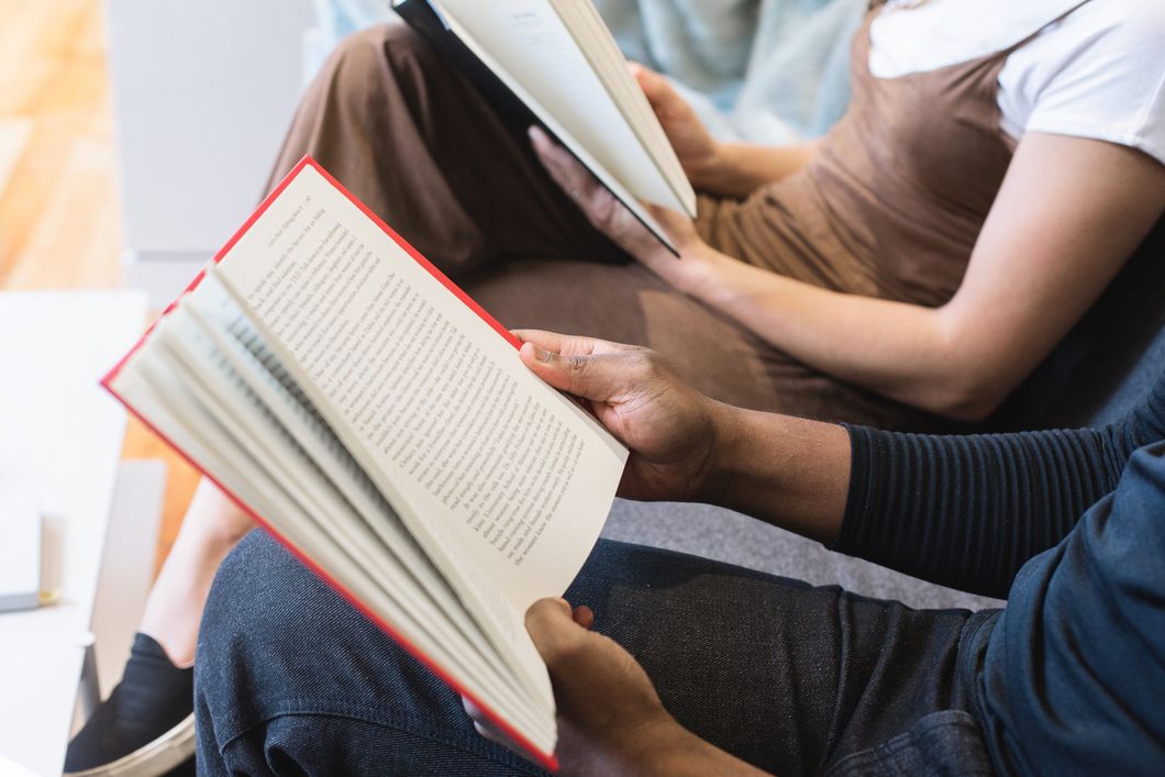 https://www.pexels.com/photo/man-reading-book-beside-woman-reading-book-545068/