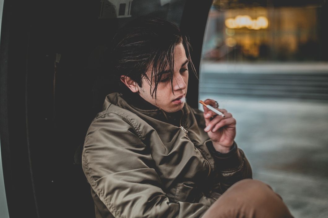 https://www.pexels.com/photo/man-wearing-gray-jacket-holding-cigarette-958946/