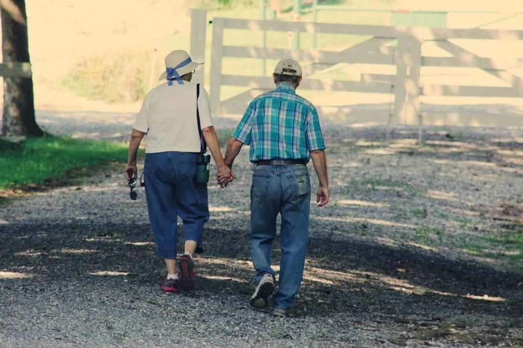https://www.pexels.com/photo/old-couple-walking-while-holding-hands-906111/