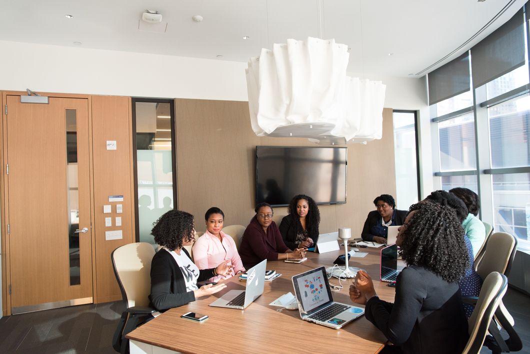 https://www.pexels.com/photo/people-sitting-around-brown-wooden-table-under-white-pendant-lamp-inside-room-1181435/