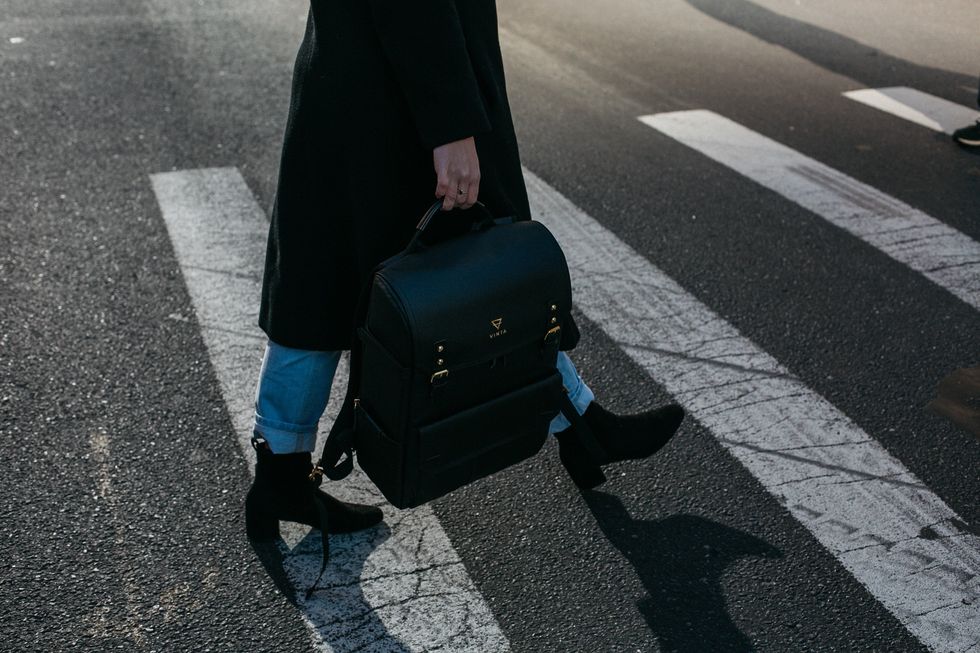 https://www.pexels.com/photo/person-carrying-bag-walking-on-pedestrian-lane-842963/