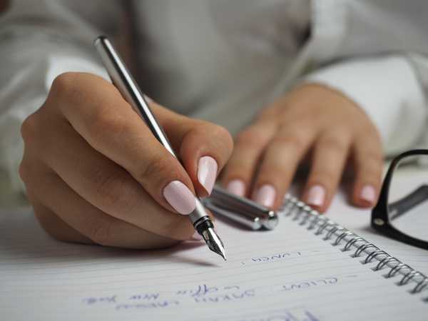 https://www.pexels.com/photo/person-hands-woman-pen-110473/