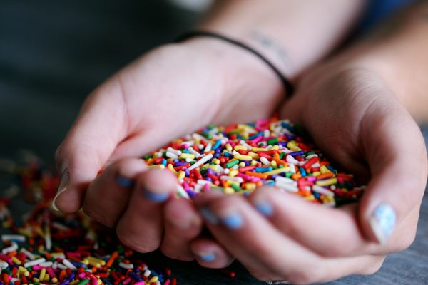 https://www.pexels.com/photo/person-holding-full-of-sprinkles-1174082/