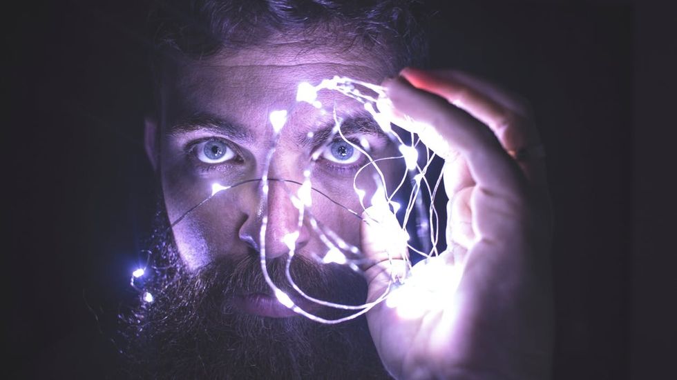 https://www.pexels.com/photo/person-holding-string-lights-photo-818563/