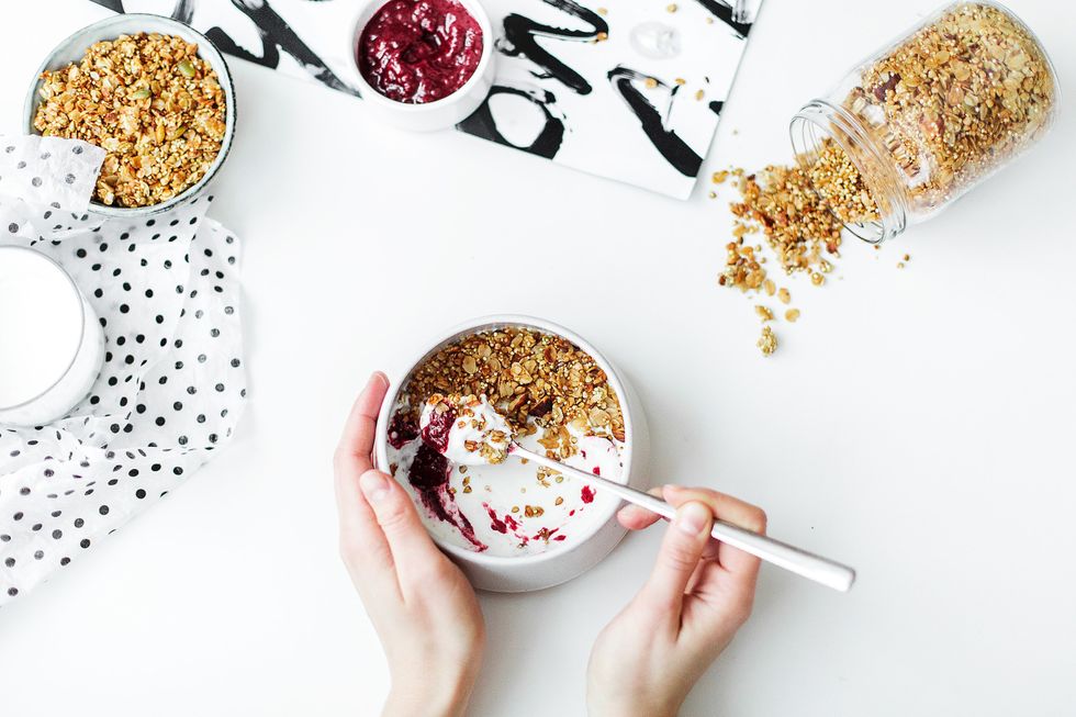 https://www.pexels.com/photo/person-mixing-cereal-milk-and-strawberry-jam-on-white-ceramic-bowl-704971/