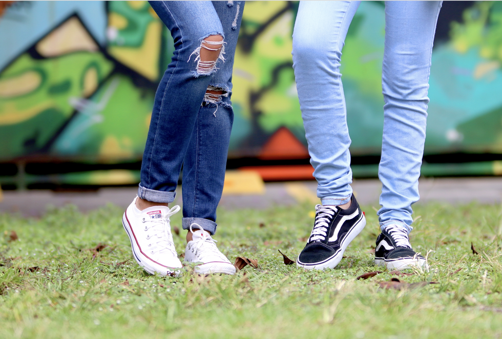 https://www.pexels.com/photo/person-s-wearing-white-and-black-low-top-sneakers-981619/