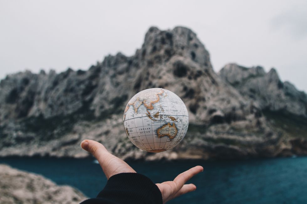 https://www.pexels.com/photo/person-tossing-globe-1275393/