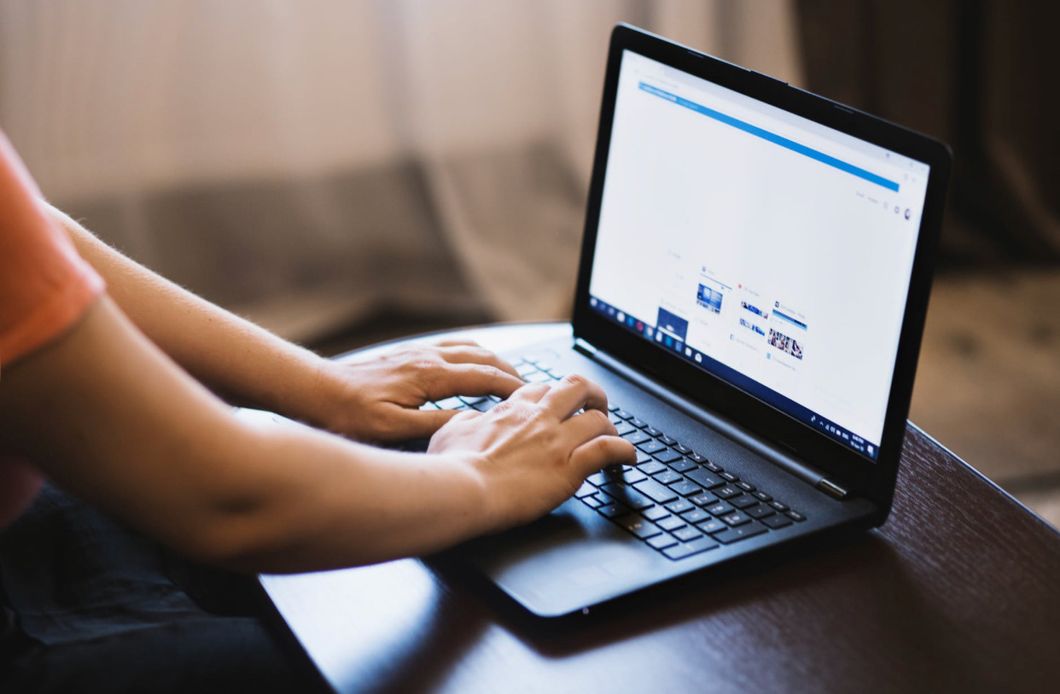 https://www.pexels.com/photo/person-typing-on-laptop-1174775/