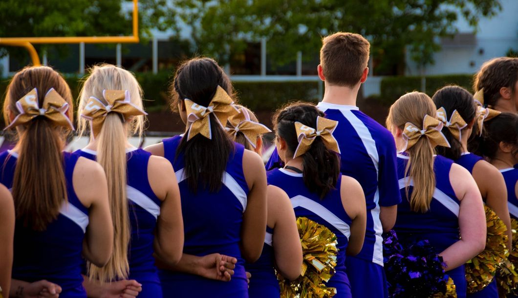 https://www.pexels.com/photo/photo-of-cheerleaders-in-blue-and-white-uniform-685379/