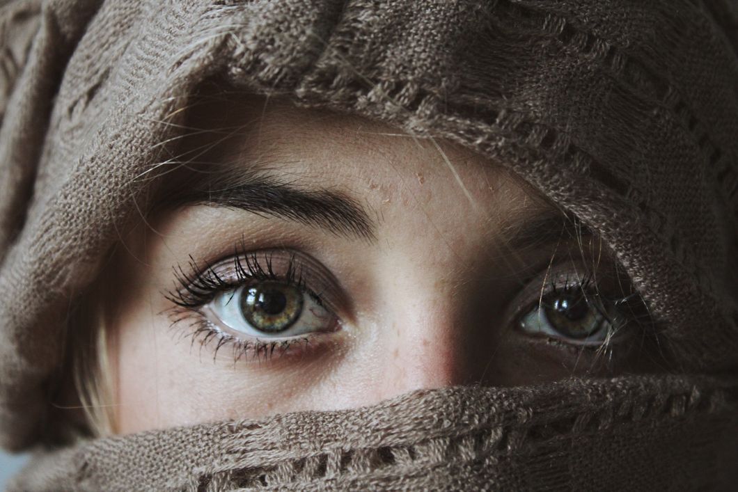 https://www.pexels.com/photo/photo-of-person-covered-with-brown-textile-906052/