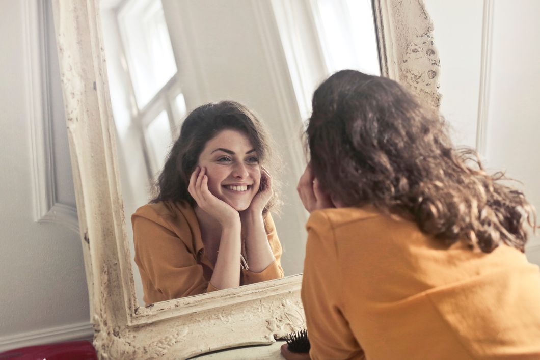 https://www.pexels.com/photo/photo-of-woman-looking-at-the-mirror-774866/