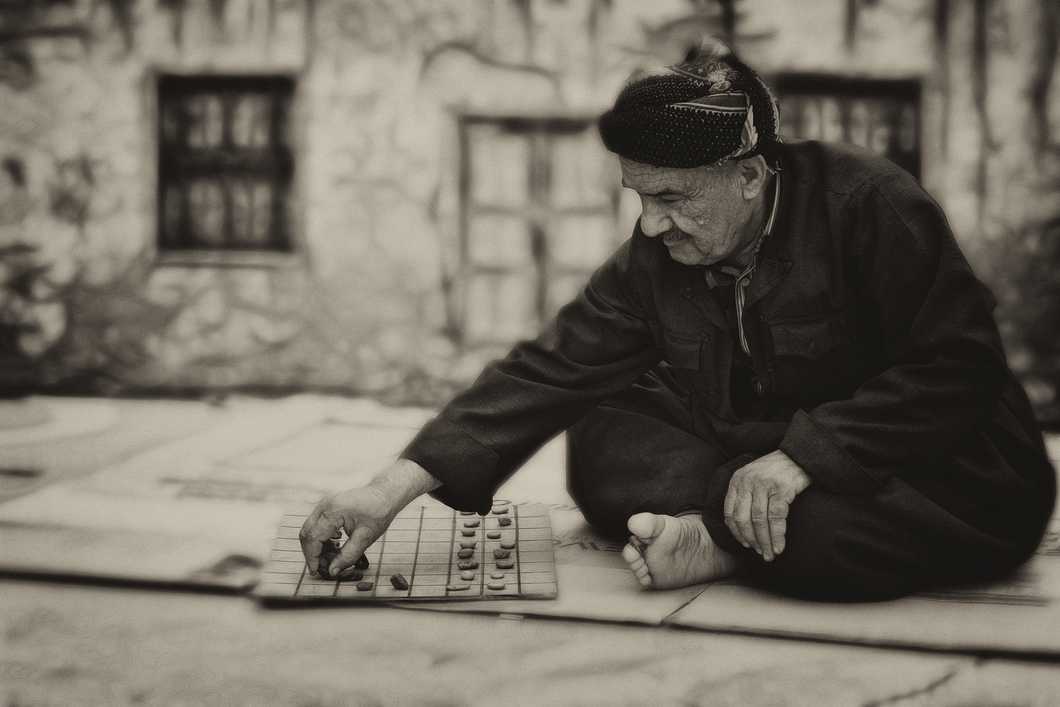 https://www.pexels.com/photo/playing-board-game-person-old-18497/
