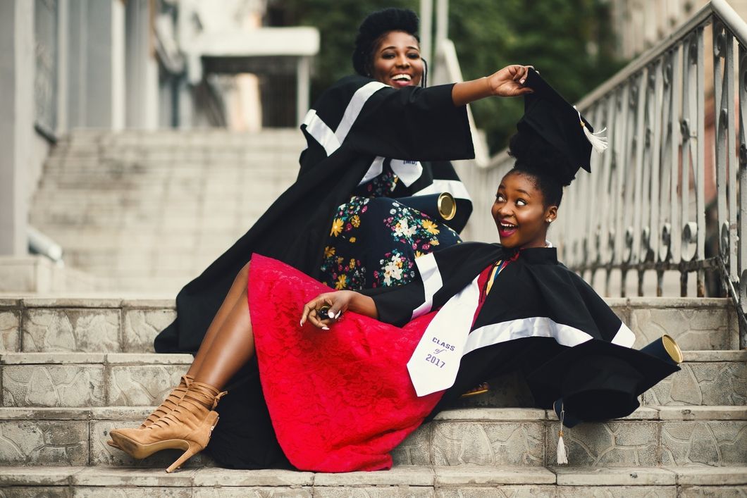 https://www.pexels.com/photo/shallow-focus-photography-of-two-women-in-academic-dress-on-flight-of-stairs-901964/