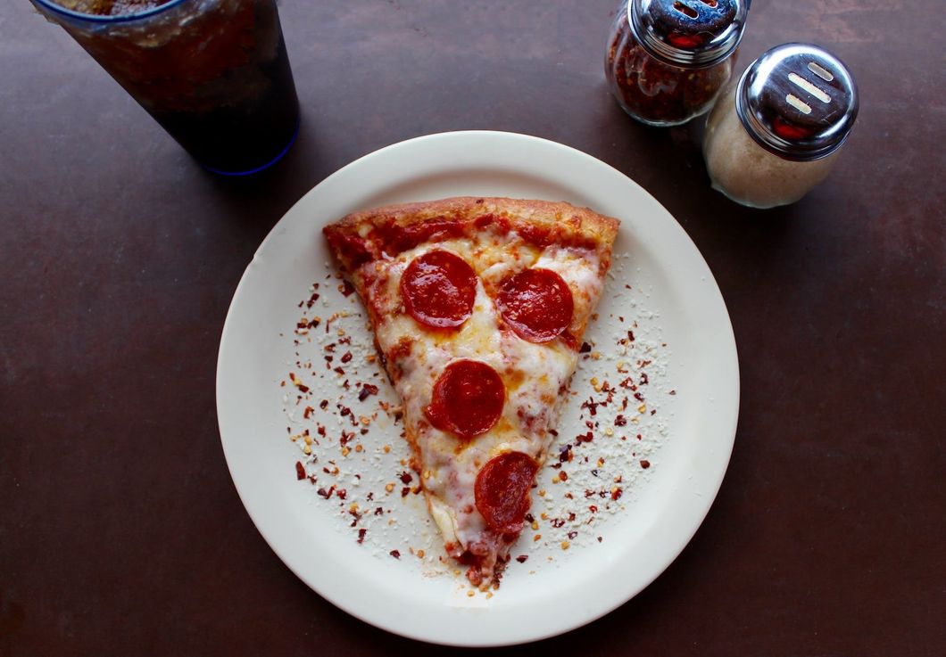 https://www.pexels.com/photo/sliced-pepperoni-pizza-on-white-ceramic-plate-708587/