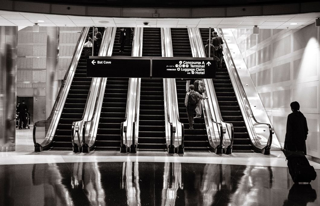 https://www.pexels.com/photo/stairs-people-airport-escalators-4610/