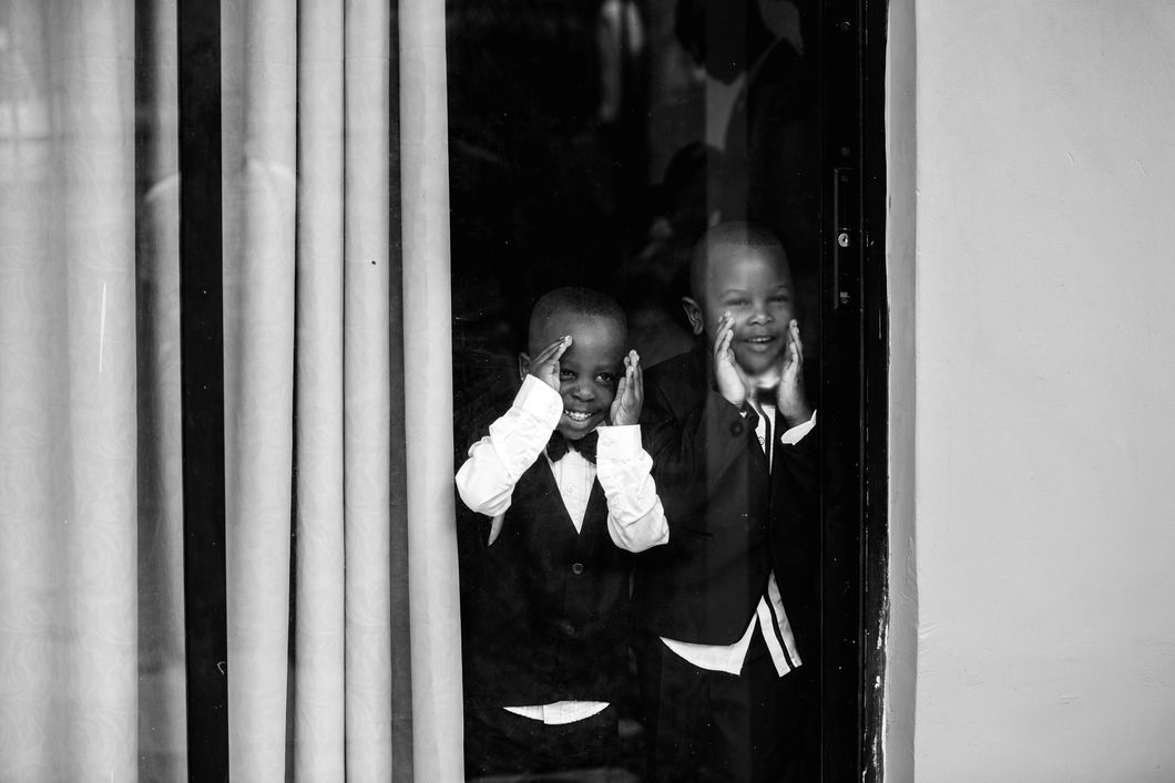 https://www.pexels.com/photo/two-boys-in-front-of-glass-window-1025870/