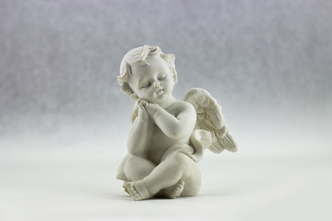 https://www.pexels.com/photo/white-ceramic-figurine-of-angel-illustration-52718/