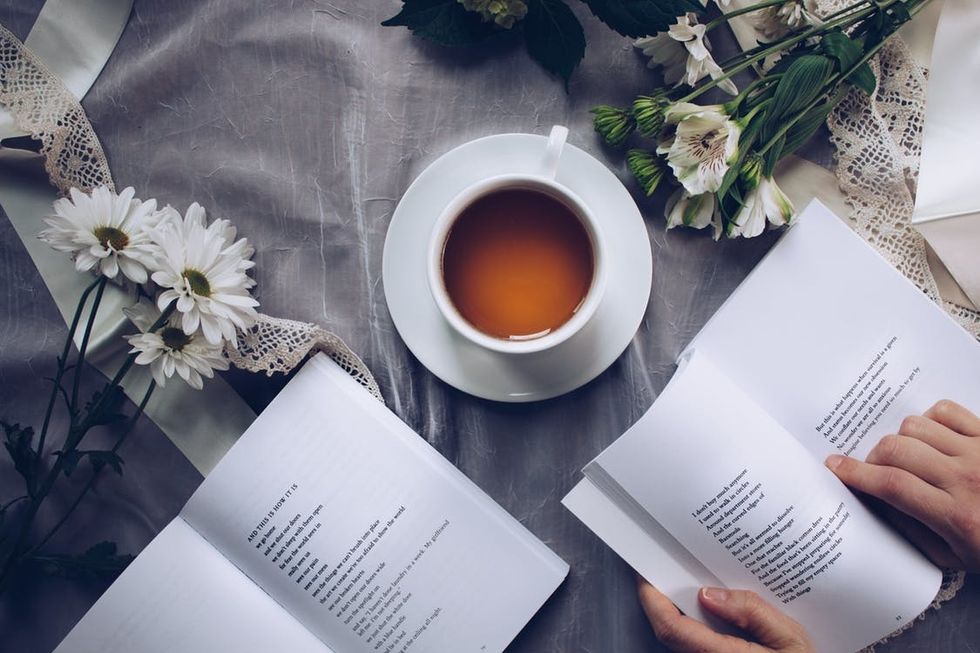 https://www.pexels.com/photo/white-ceramic-teacup-with-saucer-near-two-books-above-gray-floral-textile-904616/