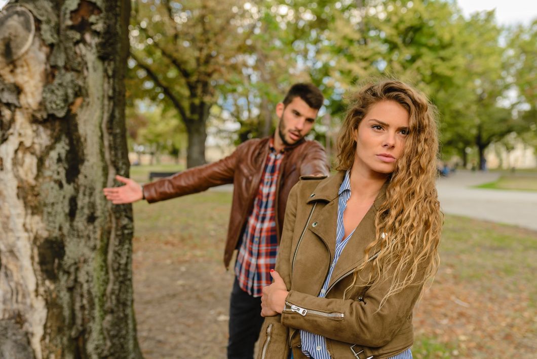 https://www.pexels.com/photo/woman-and-man-wearing-brown-jackets-standing-near-tree-984954/