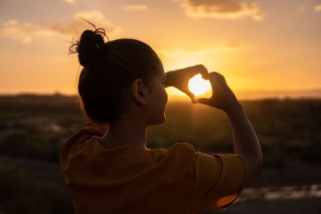 https://www.pexels.com/photo/woman-doing-hand-heart-sign-1535244/