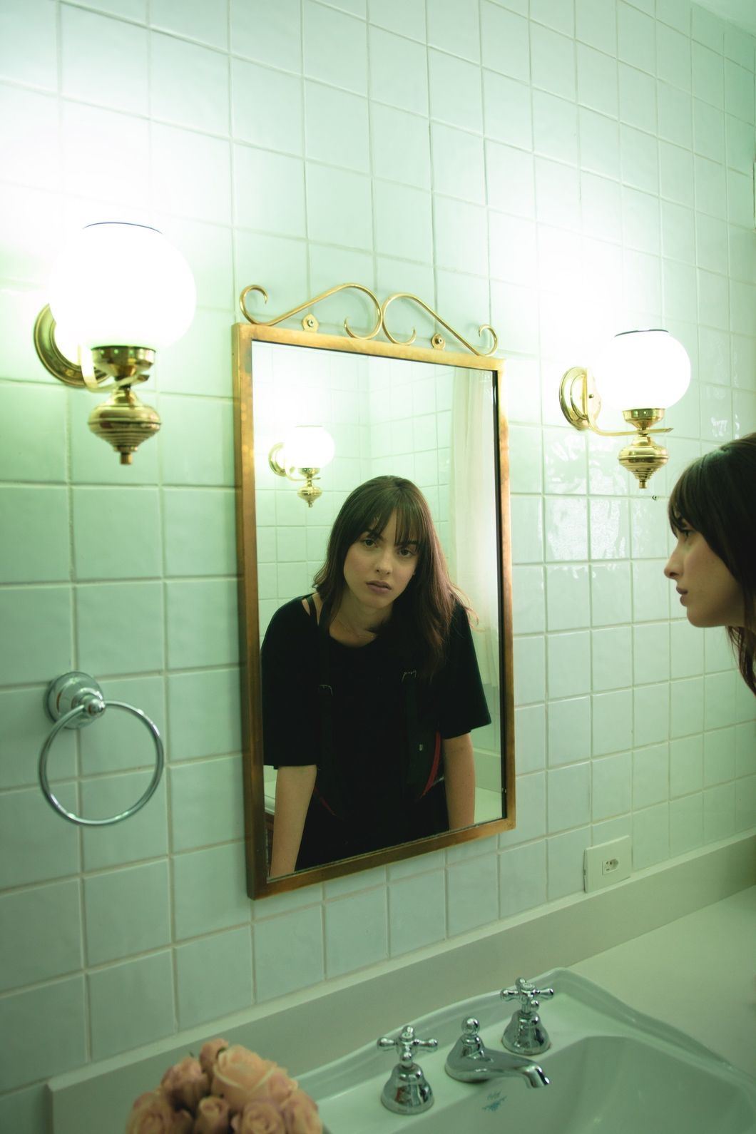 https://www.pexels.com/photo/woman-in-black-t-shirt-staring-on-wall-mirror-2043599/