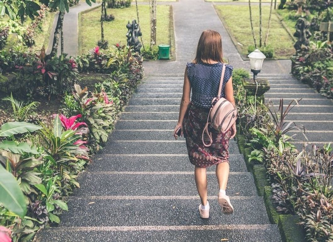 https://www.pexels.com/photo/woman-in-blue-and-red-dress-walking-down-the-stairs-929162/
