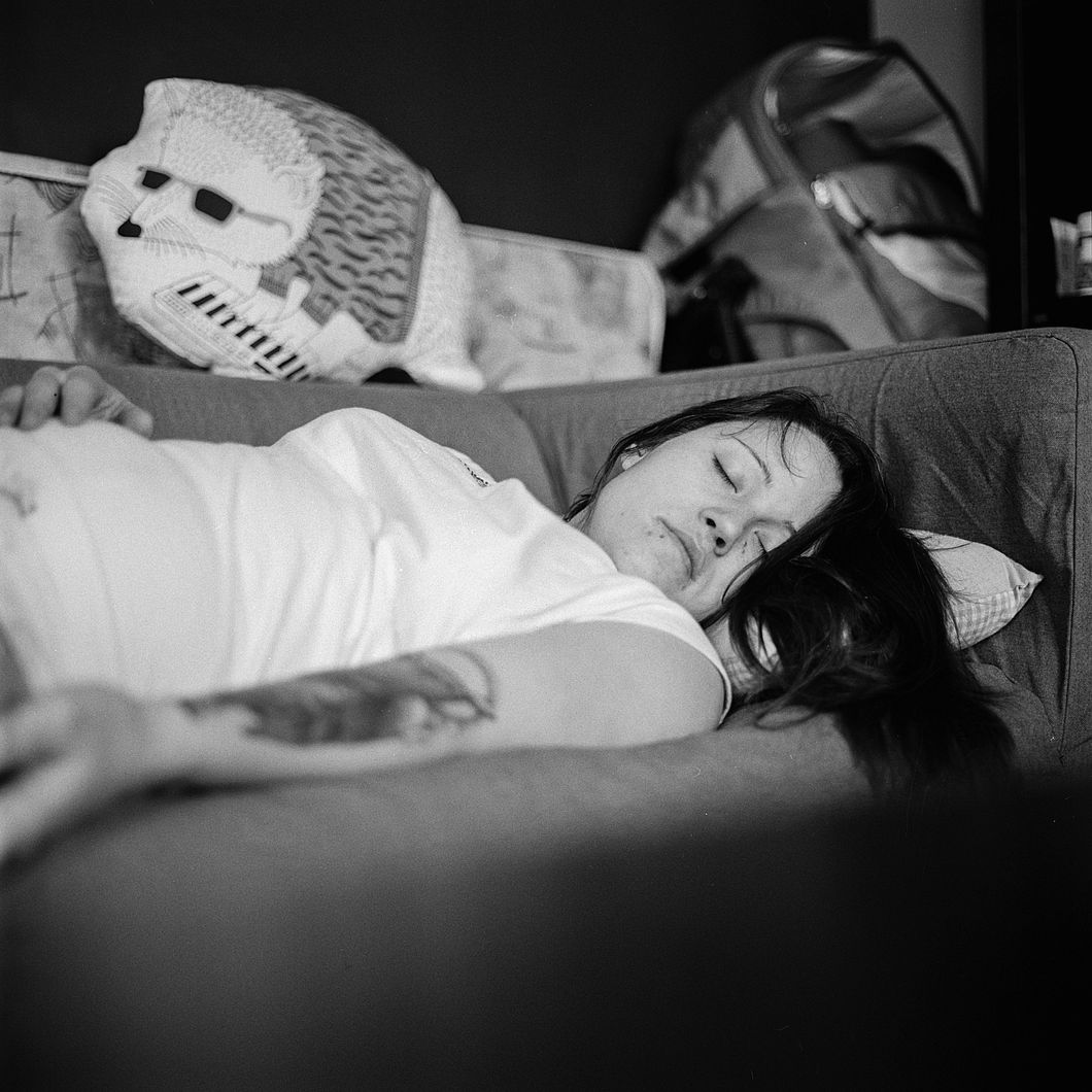 https://www.pexels.com/photo/woman-in-white-shirt-sleeping-on-gray-fabric-sofa-156085/