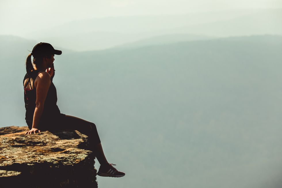 https://www.pexels.com/photo/woman-sitting-on-cliff-1202822/