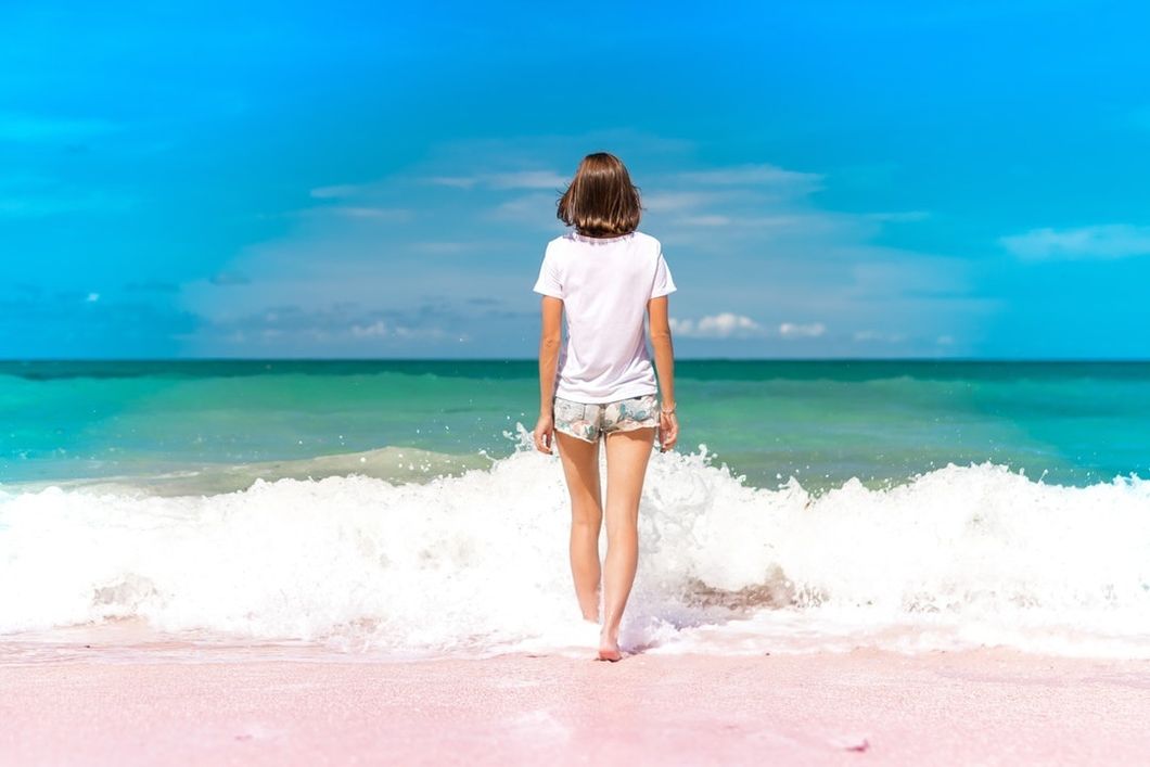 https://www.pexels.com/photo/woman-standing-on-seashore-884169/