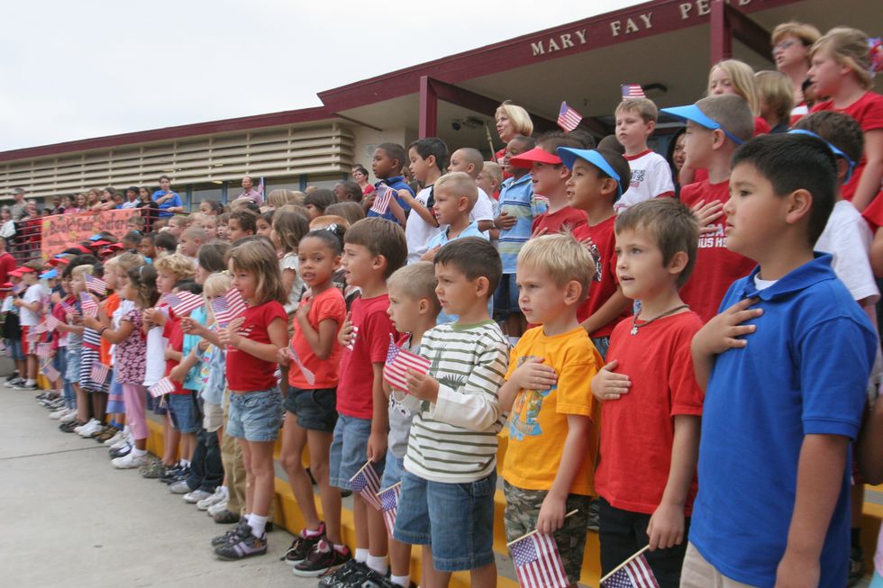 It's OK To Sit During The Pledge Of Allegiance Because Forced Patriotism Violates Our Constitutional Rights