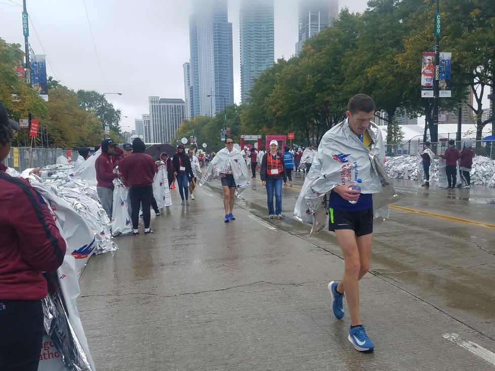 Thousands Of Volunteers Work At Bank Of America's Chicago Marathon To Accommodate Runners