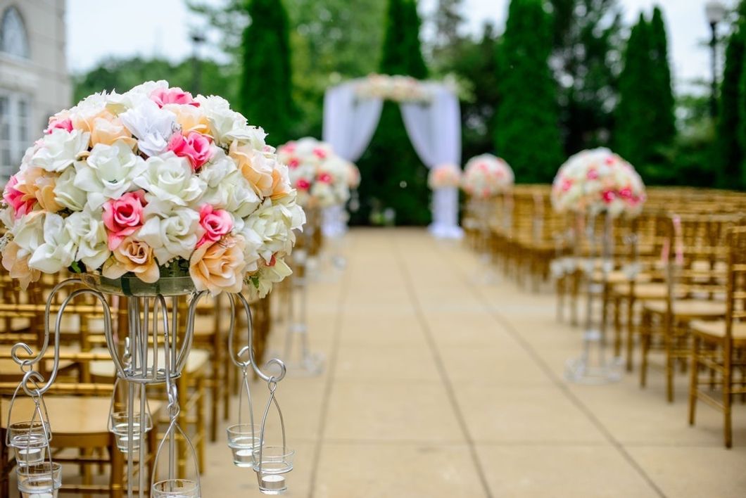 Why Brides Want A Venue Rather Than A Backyard Wedding, And It's Not What You Think