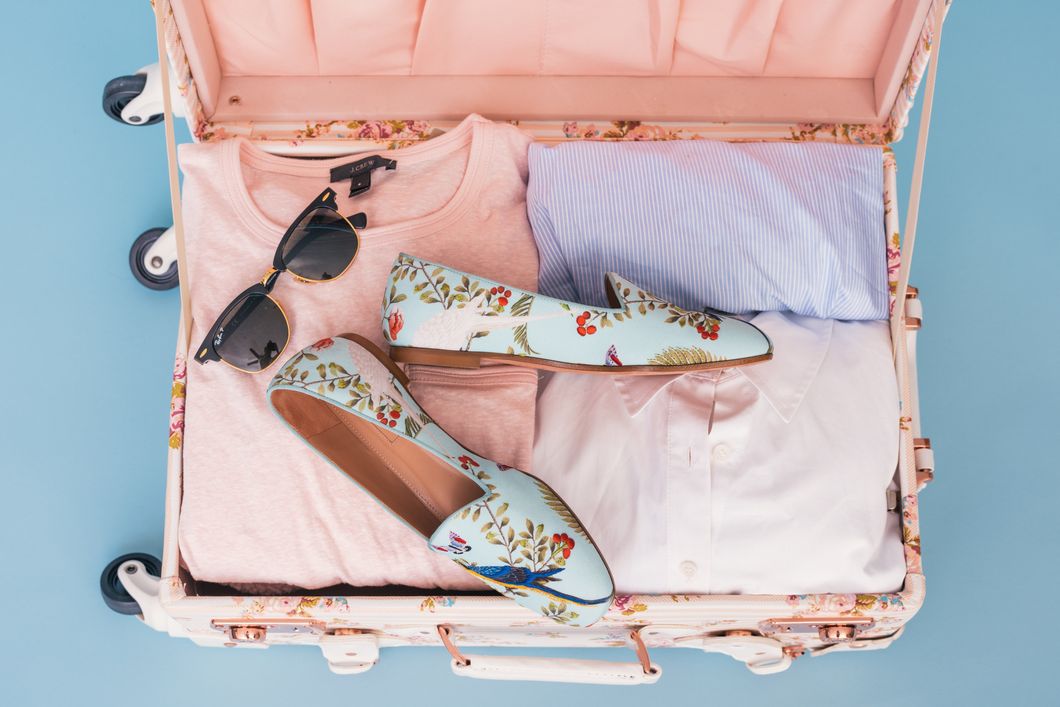 4 Ways To Pack Light For Vacation That Don't Involve Wearing The Same Shirt Every Day