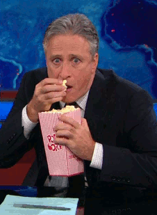 John Stewart Eating Popcorn gif