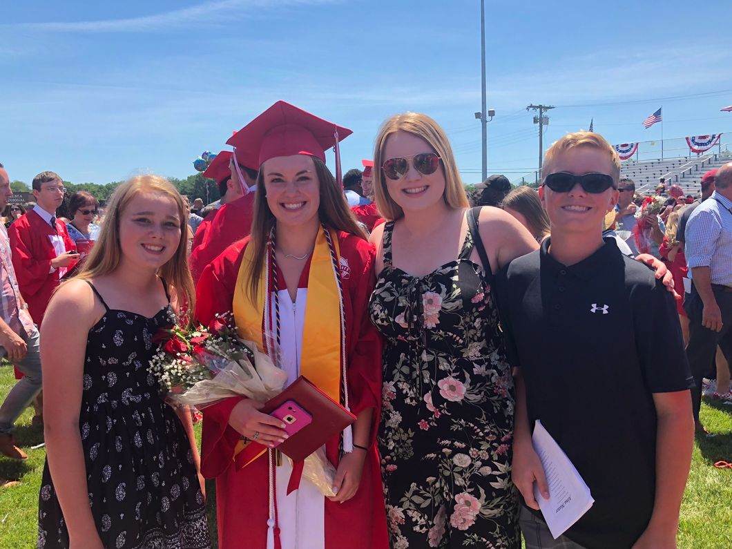Kayla with her sisters and brother at graduation