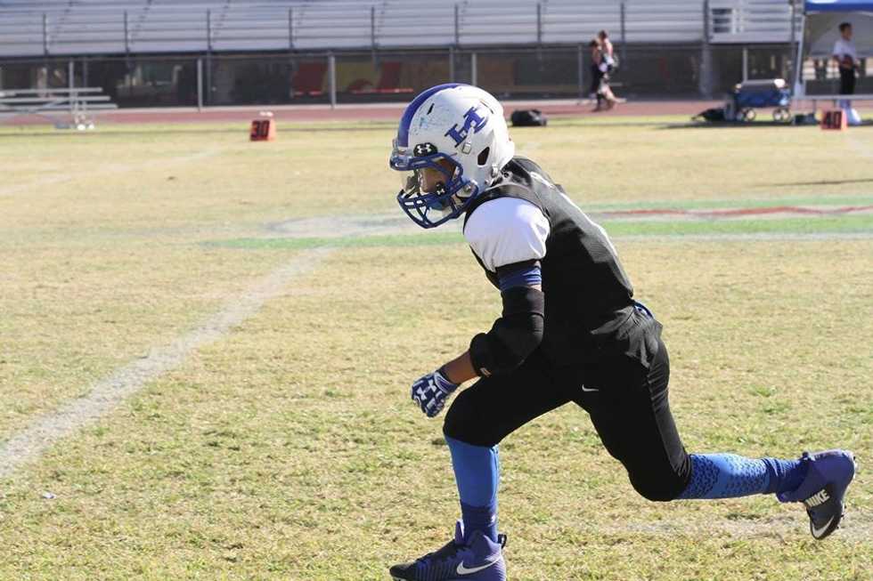 Keona Espinoza recovering a fumble on defense