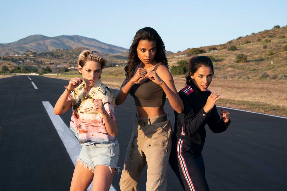 Kristen Stewart, Ella Balinska and Naomi Scott stand side-by-side ready to fight with their fists up in 2019's "Charlie's Angels."