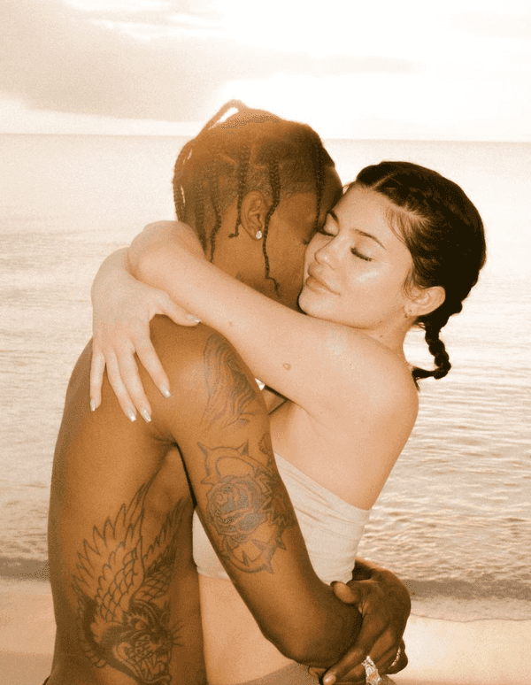 kylie jenner and travis scott hugging on beach