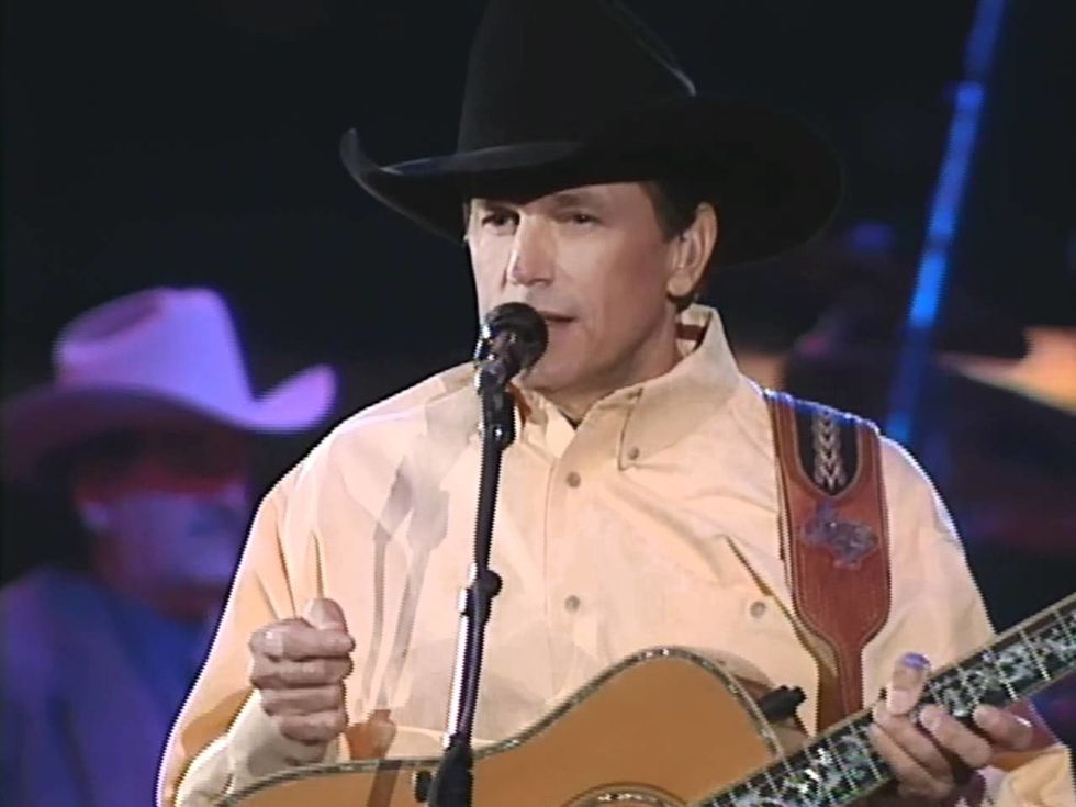 Lyrical genius George Strait poses with a cowboy hat