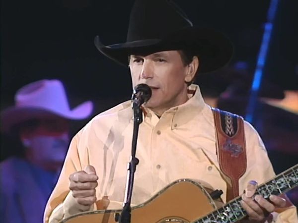 Lyrical genius George Strait poses with a cowboy hat
