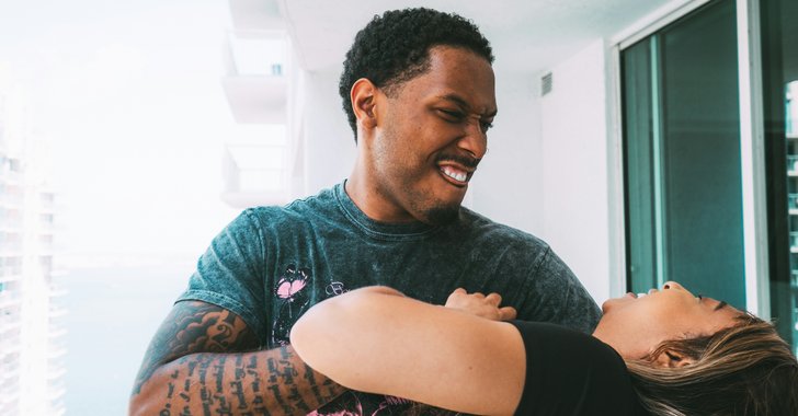 man and woman playfully engaged in a prank