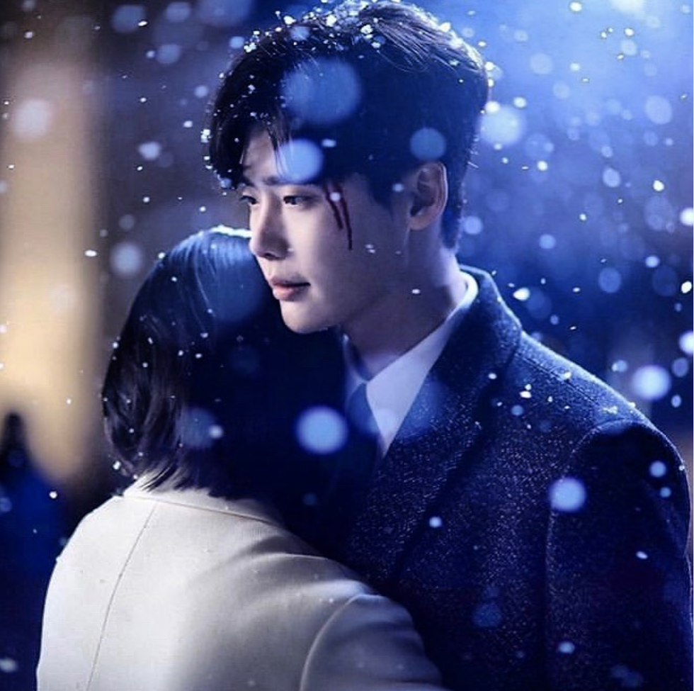 Man hugging girl in the snow