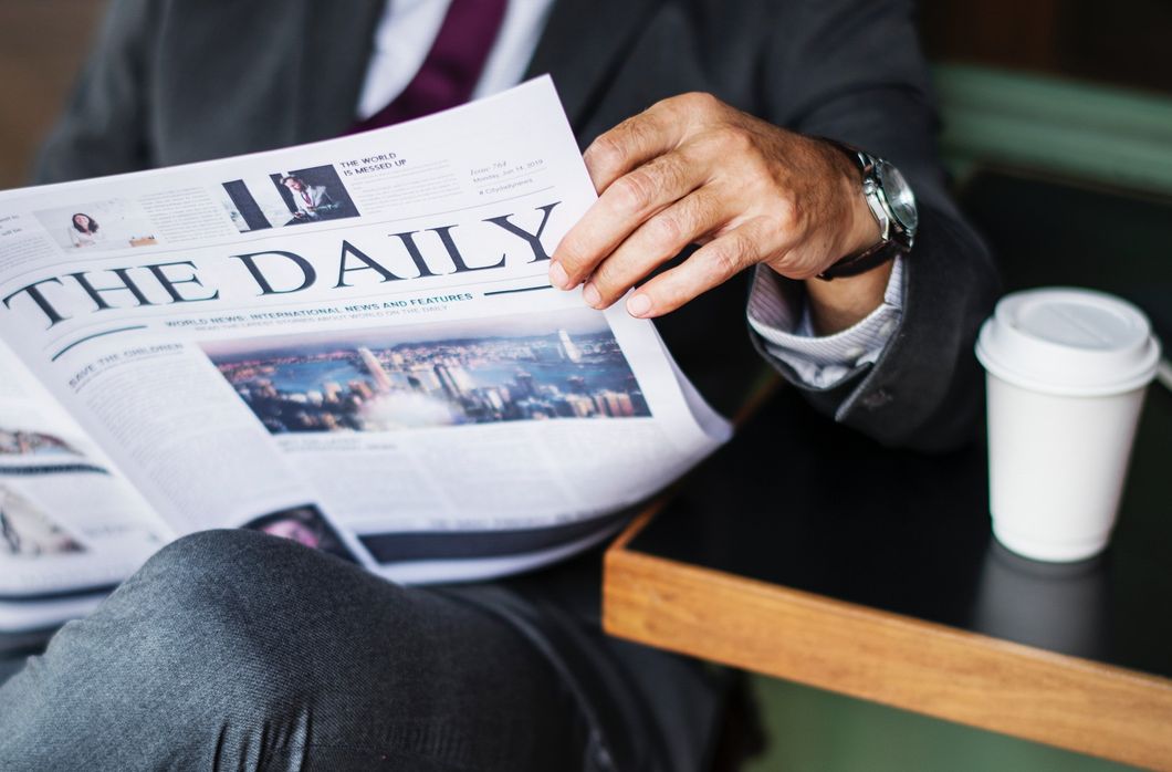 man reading newspaper