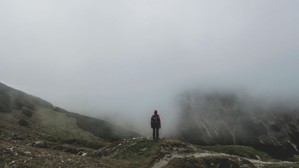 man standing on mountain