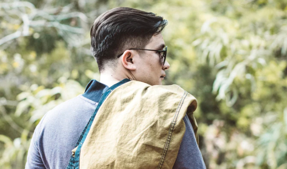 man with back to camera wearing sunglasses